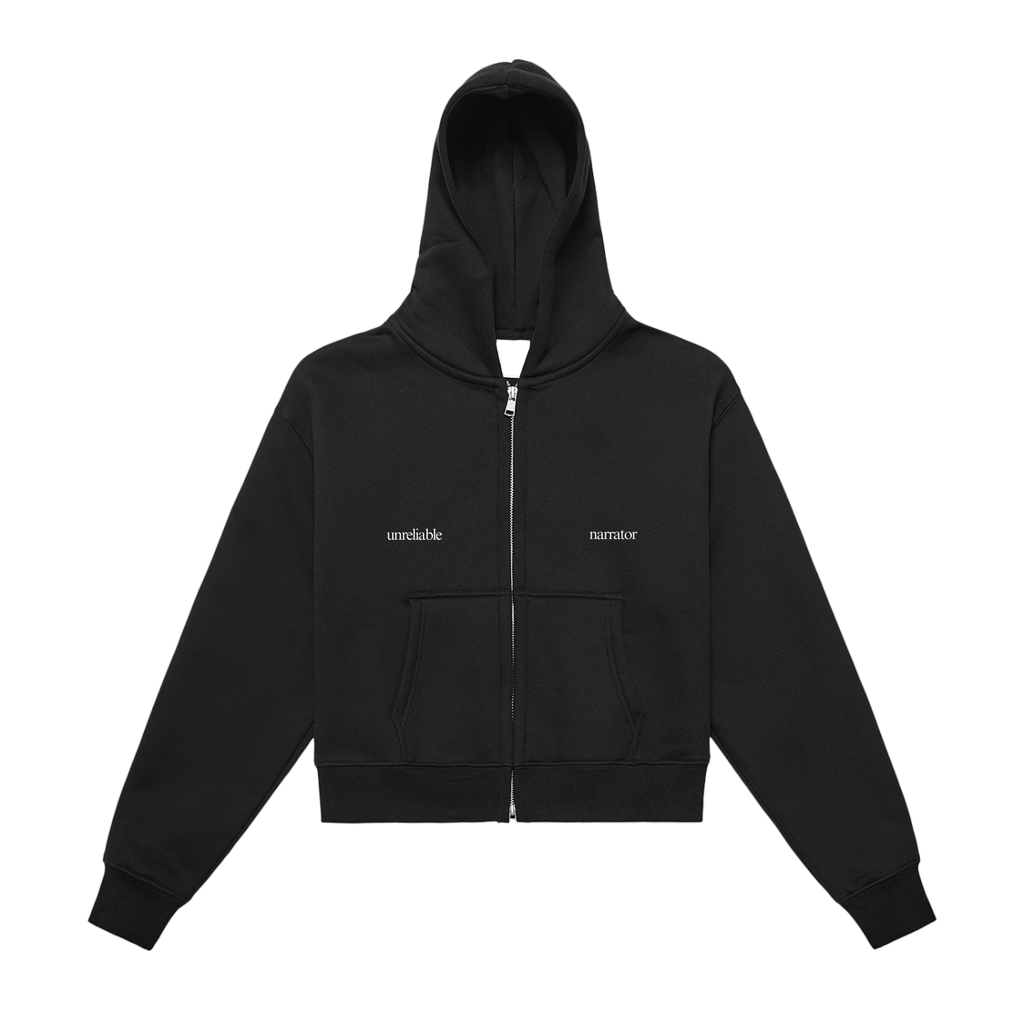 Black hoodie with a zipper on a white background that reads "unreliable narrator"